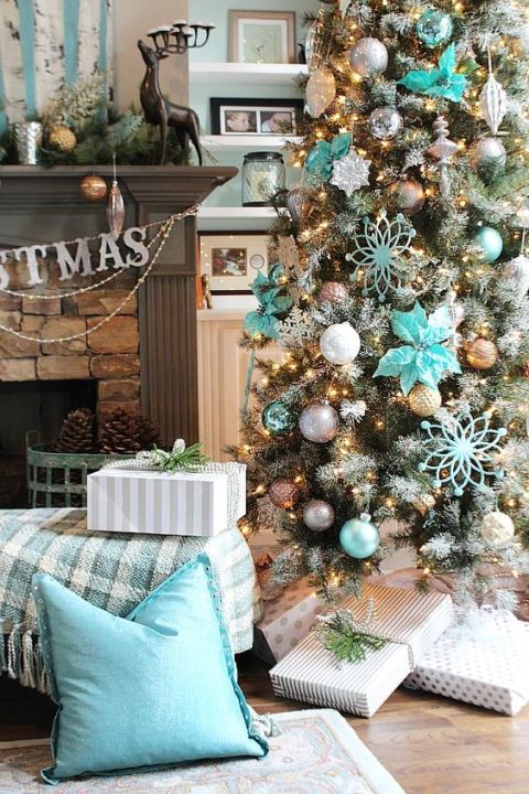 Icy blue Christmas decor with touches of silver, gray, and gold make this Christmas tree a dazzling one. <br>Get the tutorial at Refresh Restyle.