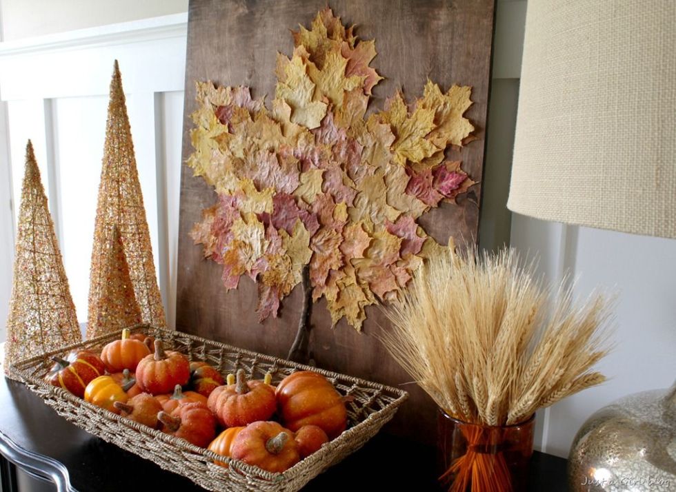 Collect fallen leaves from your backyard and turn them into a beautiful piece of art. 
Get the tutorial at Just a Girl. 
