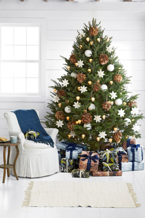 Fluffy ornaments that recall pheasants and feather boas, pinecones lit from within, white porcelain globes, and origami-like poinsettias: These babies do rustic in a very refined way.</p>
<p>Plus: Everything you need for a naturally elegant Christmas