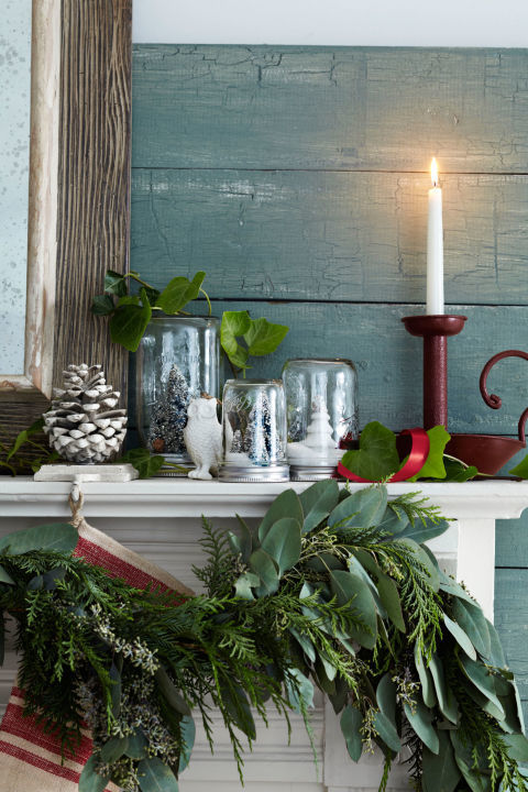 Give Mason jars a farmhouse-chic makeover by filling them with mini trees and snow, then placing them on your mantel.
