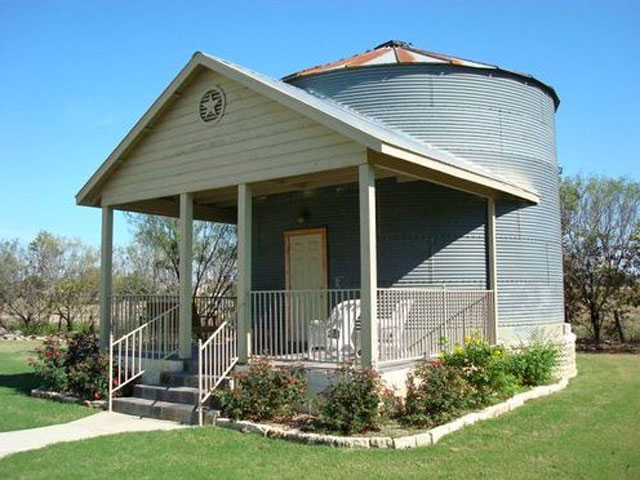 One of the Gruene Homestead Inn's vacation rentals, this 1940s silo contains a loft-style apartment with a kitchenette, stand-up shower, and a king-sized bed upstairs. 