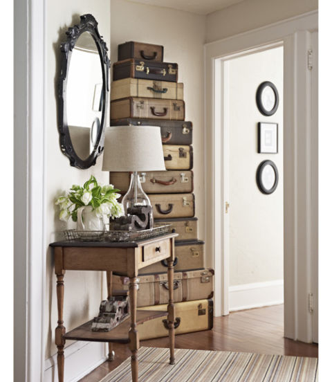 Put treasures to work. Stacked up, vintage suitcases "read as a single unit of furniture, like a cabinet," says Madden. And this gorgeous grouping doesn't just stand there looking good: The family stows off-season stuff, such as holiday ornaments, in each "drawer."