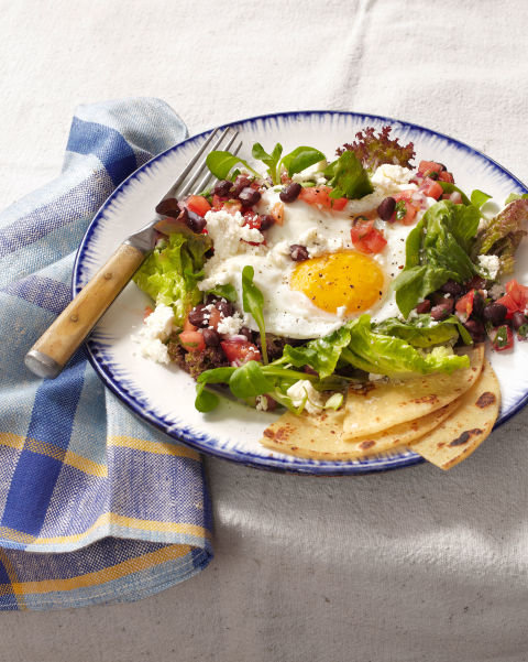 A bright, sunny-side-up fried egg steals the show on this Southwestern salad topped with queso fresco, cilantro, and a citrusy black-bean-and-tomato salsa. Recipe: Huevos Rancheros Salad 