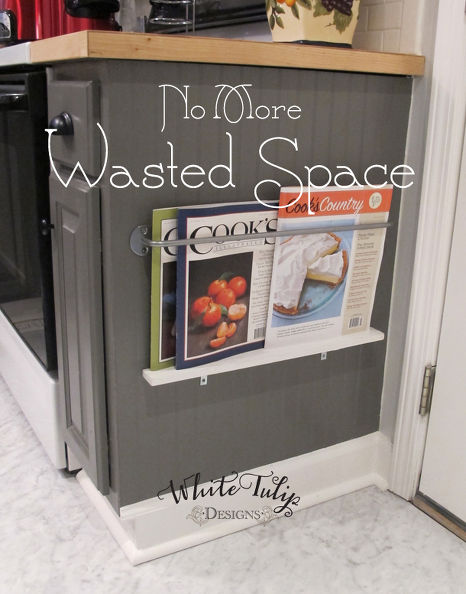 Keep food magazines handy by installing a holder on side cabinets or an island. This area is too low to store items you use regularly, but is great for items that might otherwise get lost in the shuffle.
See more at White Tulip Designs »
