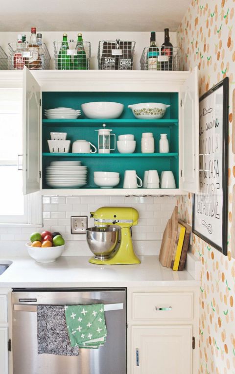 Your pantry can only hold so many items. Use the area above your cabinets to corral items you wish you could keep on hand, but don't always have space for.
See more at A Beautiful Mess »
