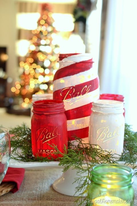 Painted Mason jar luminaries are an easy way to add Christmas cheer to your dining table. Get the tutorial at The Frugal Homemaker. 